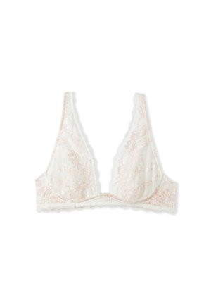 Bralette in pizzo di un rosa chiaro e bianco, con un profondo scollo a V, bordi ondulati e motivi floreali in tutto. Senza ferretto.