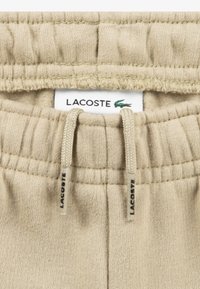 Lacoste CORE PANT UNISEX - Treniņtērpa apakšdaļas - beige
