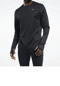 Svart långärmad träningströja i mjukt, stretchigt material, med tumhål vid ärmsluten och en liten logotyp på bröstet.