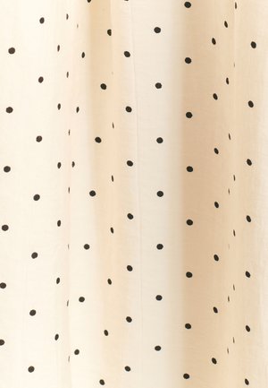 Cremefarbener Stoff mit schwarzen Polka-Dots, leichter Textur, fallende Optik, mit gleichmäßig verteilten kreisförmigen Mustern.