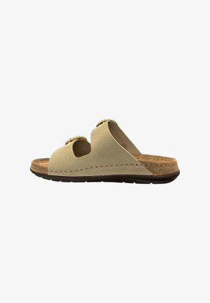 Beige ruskindssandal med to guldlåse-stropper, brun polstret fodseng og sort tekstureret sål, vist fra siden.