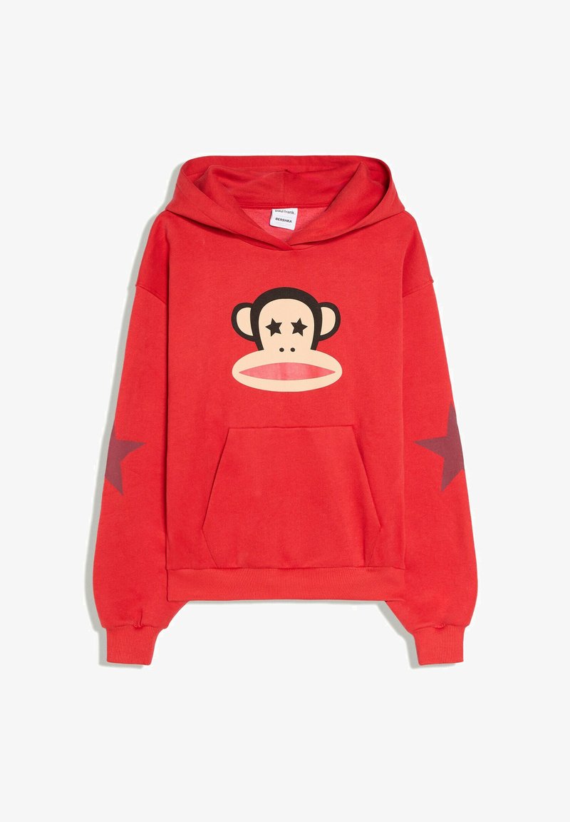 Sweat-shirt à capuche rouge avec un visage de singe dessiné animé aux yeux en forme d'étoile sur la poitrine et des étoiles rouge foncé sur les deux manches.