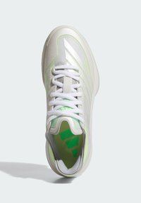 White and light green athletic sneaker with white laces, mesh upper, and green logo visible on the insole, shown from above.