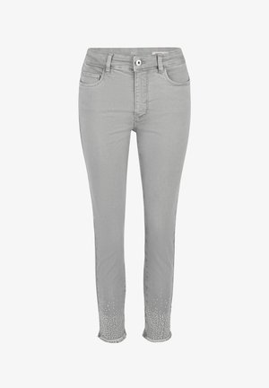 Light grey slim-fit jeans with front pockets, button and zipper closure, featuring small white dot embellishments and frayed hems at the ankles.