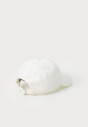 White cotton baseball cap with a curved brim, six panels, and an adjustable metal strap at the back for fitting.