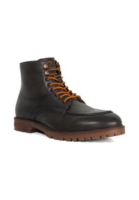 Black leather ankle boot with orange laces, rounded toe, stitched detailing, and a brown rubber sole with traction patterns.