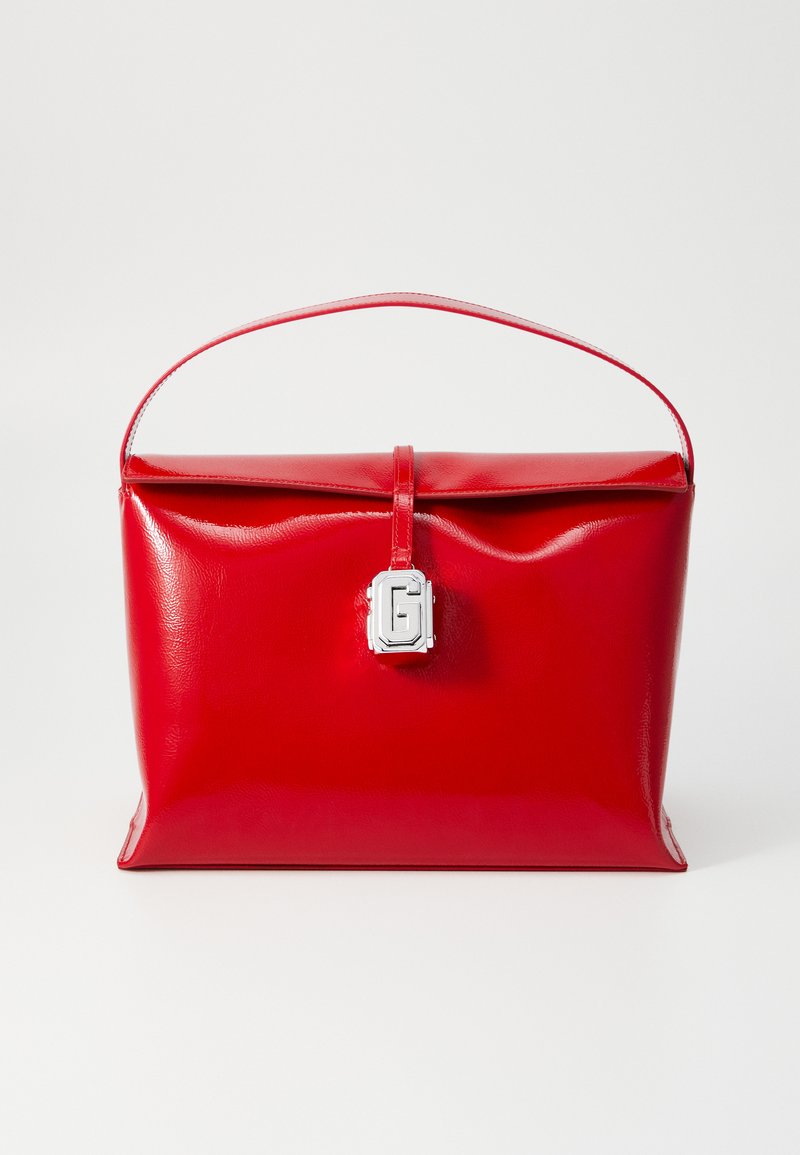 Red leather handbag with a glossy finish, rectangular shape, a top handle, and a silver clasp featuring a geometric design.