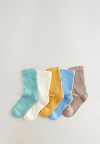 Five pairs of ribbed crew socks in teal, white, mustard yellow, light blue, and taupe, arranged side by side on a light background.