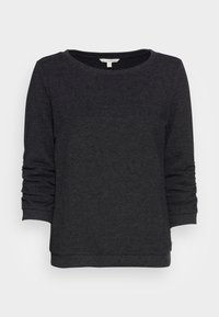 Černá mikina s texturovaným povrchem, kulatým výstřihem a rukávy t�říčtvrteční délky. Manžety a spodní lem jsou přiléhavé.