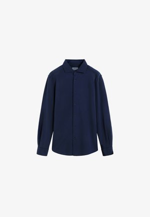 Chemise bleu marine à manches longues avec un col boutonné, des boutons sur le devant et un logo discret sur la poitrine. Fabriquée en tissu doux et texturé.