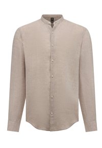Camicia beige con colletto alla mandarina, maniche lunghe e un morbido tessuto di lino texturizzato. Cinque bottoni lungo la parte anteriore. Orlo curvo.