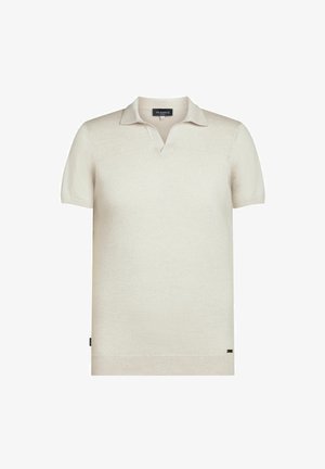 Polo à manches courtes en tissu tricoté beige clair, dotée d'un col classique et d'une marque discrète à l'ourlet. Texture lisse.