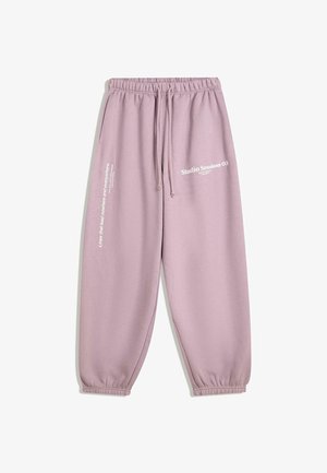 Pantaloni della tuta lilla con elastico in vita e sui polsini, cordoncino, tasche laterali e stampe bianche con la scritta "Studio Session 03" e "Linee che portano da nessuna parte e ovunque."