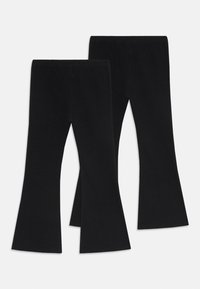 Leggings noires évasées en mélange de coton extensible, avec une taille large et un ourlet évasé pour plus de liberté de mouvement. Aucun motif visible.