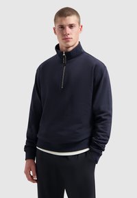 Marine sweatshirt met rits en een geribde zoom en manchetten, met een subtiel logo aan de voorkant en een gladde, gestructureerde stof.