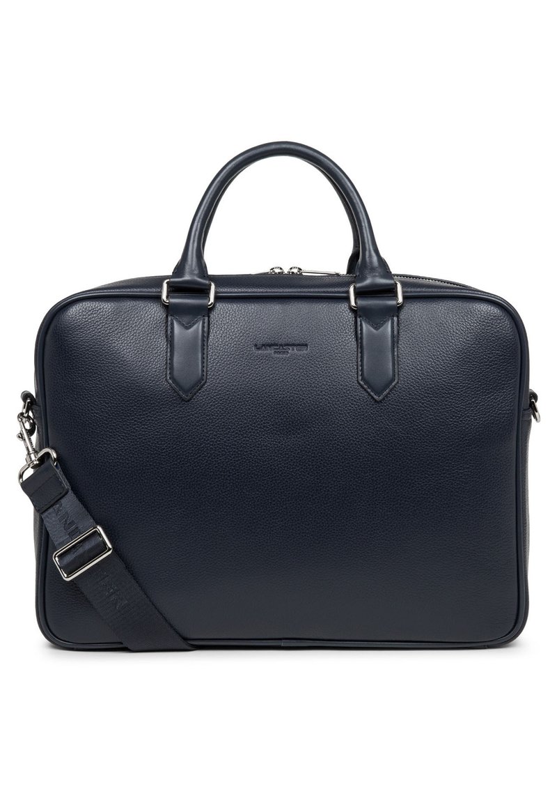 Navy leather laptop bag with a textured finish, dual handles, detachable shoulder strap, and metal zipper closure.