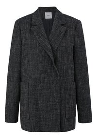 Blazer strutturato con doppio petto in bianco e nero, dotato di revers, due tasche frontali e bottoni neri. Vestibilità strutturata con maniche lunghe.