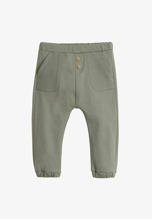 Grønne bukser i bomuldsblanding med ribbede lommeaccenter, to træknapper, elastisk talje og samlet kant.