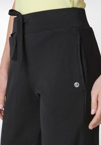 Deha Trainingsbroek - black