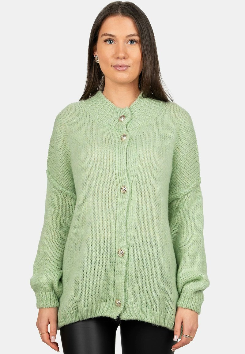 Cardigan lavorato a maglia verde chiaro con una vestibilità rilassata, colletto a coste e quattro bottoni argentati sulla parte anteriore. Tessuto morbido e testurizzato.