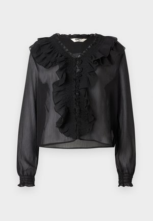 Blusa nera trasparente con maniche lunghe, colletto arricciato e chiusura frontale. Presenta dettagli arricciati e polsini elasticizzati. Tessuto leggero.