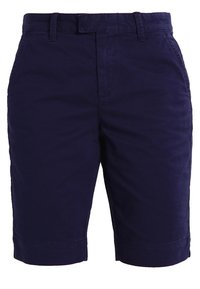 Shorts en coton marine avec une coupe droite, des poches avant et arrière, et une taille plate avec passants de ceinture. Texture lisse et design ajusté.