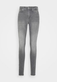 Jeans skinny feitos de denim cinza, com um efeito desbotado, design padrão de cinco bolsos e bainha desfiada no tornozelo.