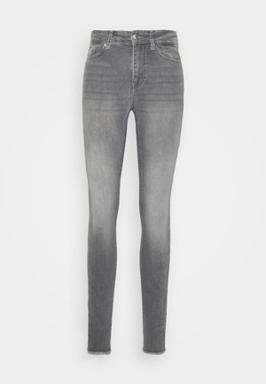 Jeans skinny feitos de denim cinza, com um efeito desbotado, design padrão de cinco bolsos e bainha desfiada no tornozelo.