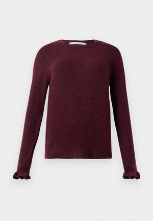Long-sleeve burgundy knit sweater with ruffled cuffs and a round neckline on a plain background.
