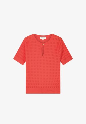 Coral short-sleeve knit top with textured square pattern, round neckline, small front keyhole with gold button closure.