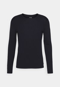 T-shirt à manches longues et col rond en bleu marine foncé. Confectionné dans un tissu lisse et extensible, avec une silhouette ajustée et des détails de couture subtils.