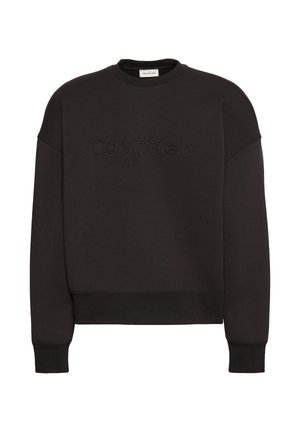 Sweat-shirt noir col rond avec manches longues, poignets et ourlet côtelés, et logo Calvin Klein embossé sur le devant.