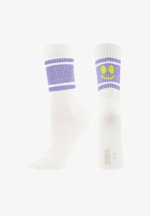 White crew socks with purple bands and a yellow smiling face design on the ankle area, shown from side and back views.