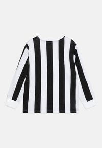 Long-sleeve shirt in black and white vertical stripes. Classic crew neck, soft fabric, and ribbed cuffs. No added embellishments.