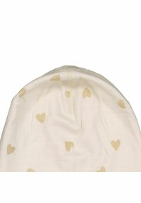 Valkoinen pipo pehmeällä puuvillatekstuurilla, jossa on hajallaan vaaleanruskeita sydänkuvioita ja keskeinen sauma päällä.