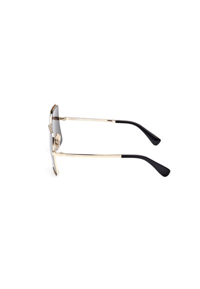Gafas de sol con montura de metal, brazos dorados y puntas negras. Las lentes son grises con degradado. Diseño slim con almohadillas nasales prominentes.