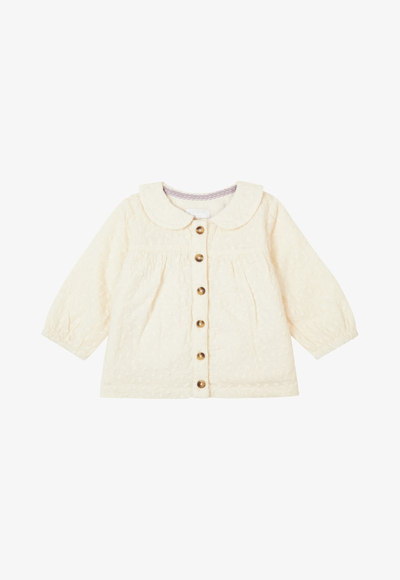 Cream quilted jacket with a Peter Pan collar, button front, and long sleeves. Features subtle floral texture and gold buttons.