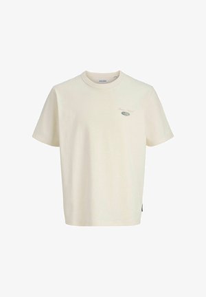 Men's short-sleeve t-shirt in cream cotton with a crew neck, featuring a small graphic logo on the chest and a side label.