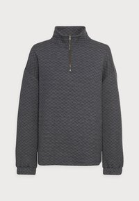 Grijze gewatteerde pullover met een hoge kraag, voorzien van een kwartrits en geribde manchetten. De stof heeft een gestructureerd ruitpatroon.