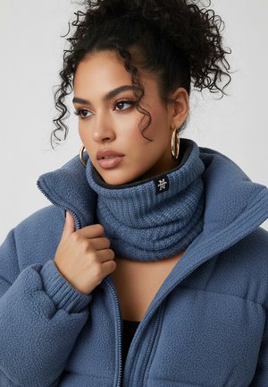 Blue fleece jacket with a high collar and ribbed turtleneck, featuring a patterned texture and a logo tag on the neck.