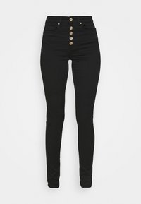 Jean noir taille haute avec une coupe slim, présentant une rangée de boutons dorés à l'avant et une texture denim standard. Aucun poches supplémentaires visibles.