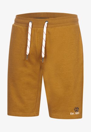 Sennepsgule shorts lavet af blødt stof. Har snørelukning i taljen med røde detaljer og et lille logo på venstre ben.