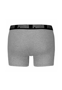 Boxer shorts de algodón gris con una cinturilla elástica negra que presenta el logo de "PUMA" en gris. Diseño simple, corte clásico y textura suave.