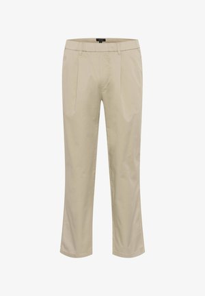 Šviesiai rudi medvilniniai kelnių su tiesiu kirpimu, su priekinėmis raukšlėmis, lygia tekstūra ir klasikinėmis juostomis. Kišenės nematomos.