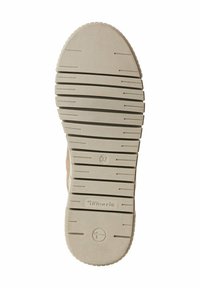 Semelle d'une chaussure, en caoutchouc, présentant un motif de grip texturé avec des lignes horizontales et verticales de couleur beige clair. Taille 37 marquée.