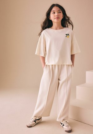 Next, REGULAR FIT - T-SHIRT AND WIDE LEG TROUSERS SET . - Tracksuit bottoms - cream fruit graphic