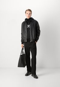 HUGO GIL ALL - Auduma bikses - black