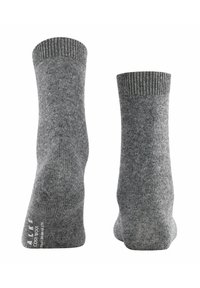 Calze di lana grigia con polsino a costine, caratterizzate da una texture liscia e tallone rinforzato. Le etichette sui lati indicano il marchio e il materiale.