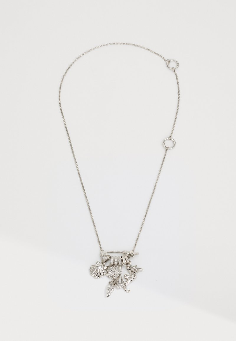 Silver chain necklace featuring a cluster of textured charms, including shells and leaves, with a smooth bar connector.