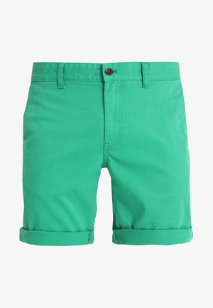 Gröna bomullsshorts med knappstängning och rullade fållar. Har en mjuk textur och klassisk passform. Inga synliga fickor.